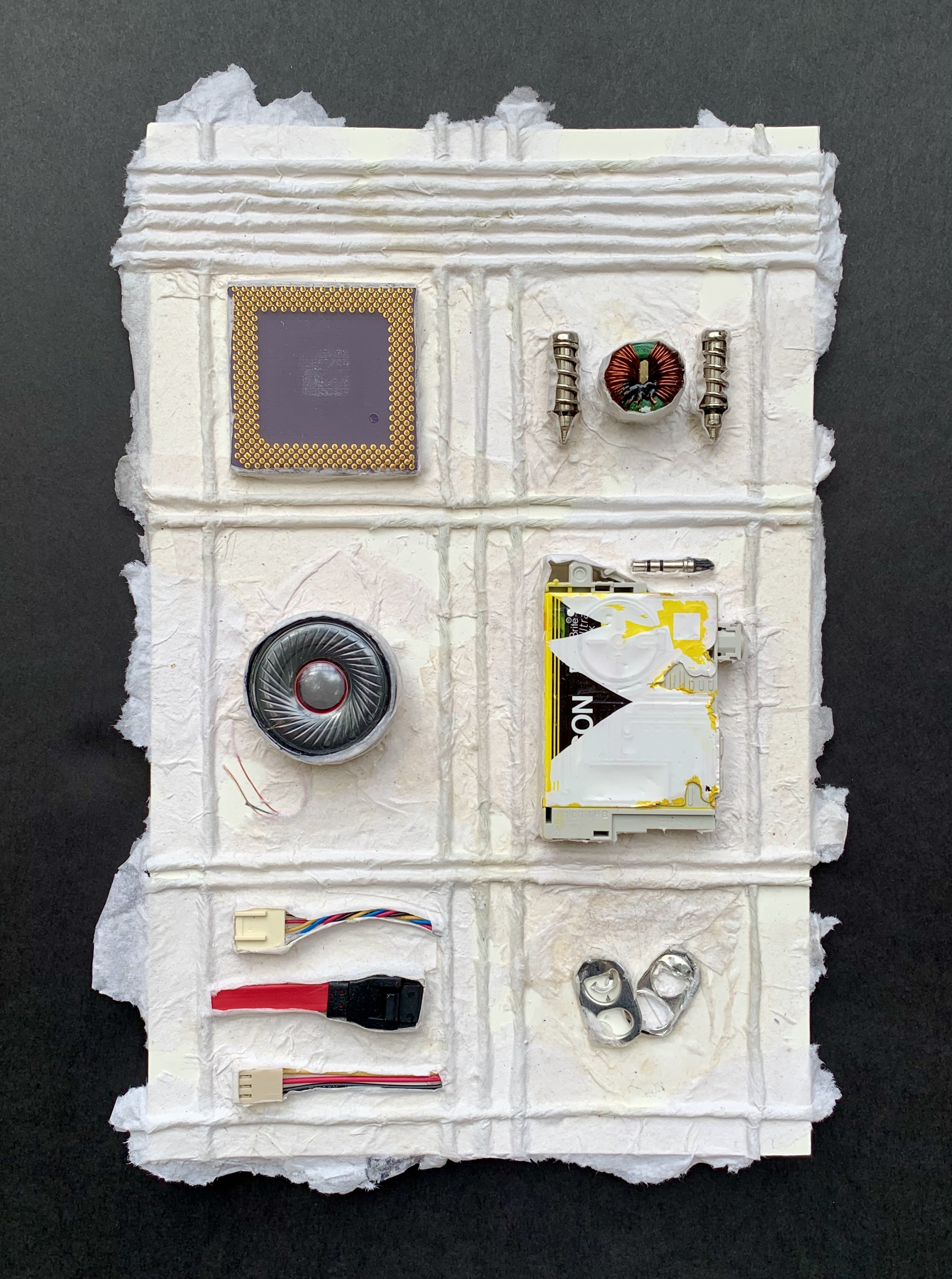 6 pieces of electronic junk displayed in a white lattice.